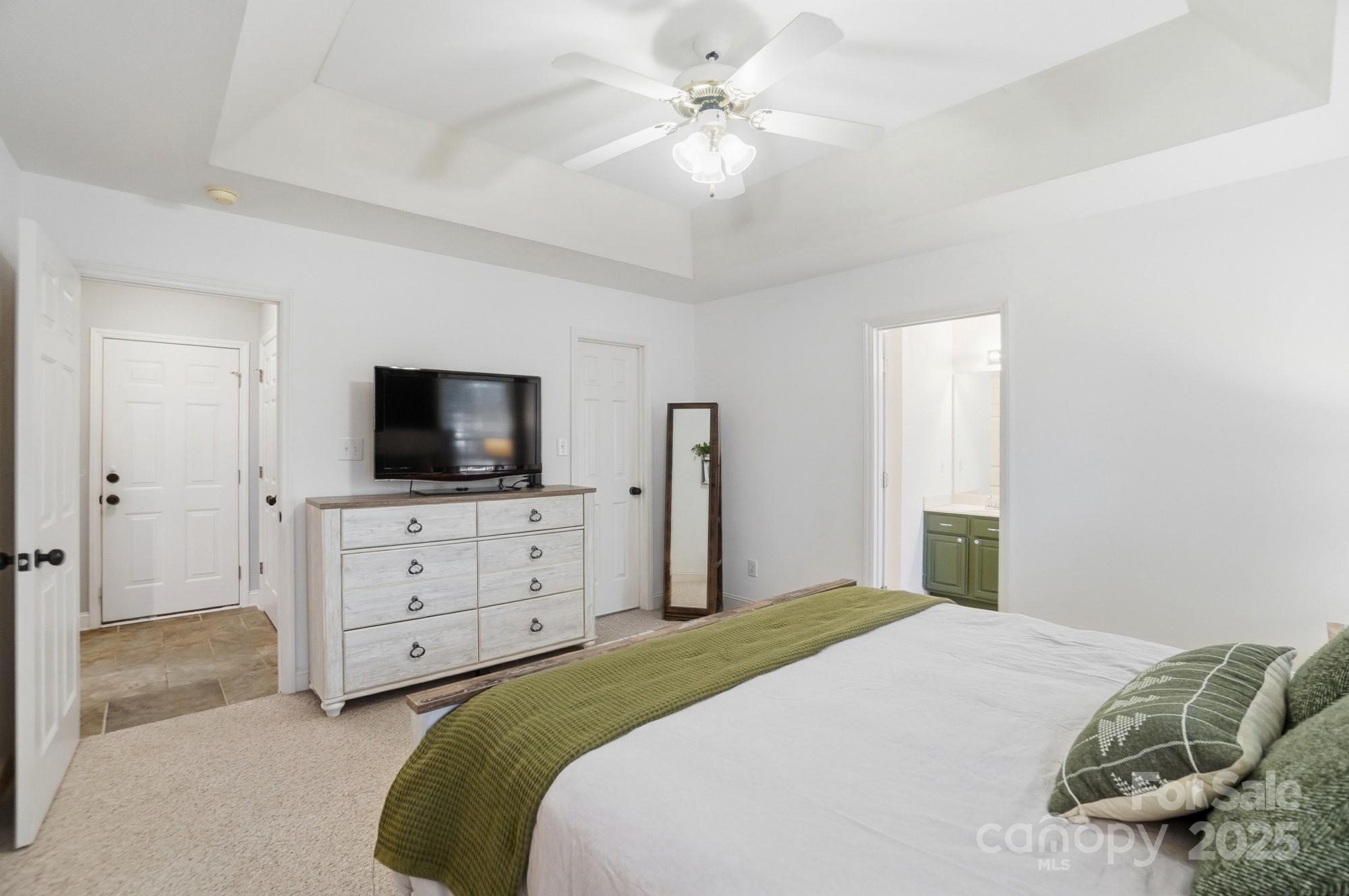 516 Jim Parker Road Monroe, NC 28110 - Photo 17 of 37 a bedroom with a bed and a flat screen tv