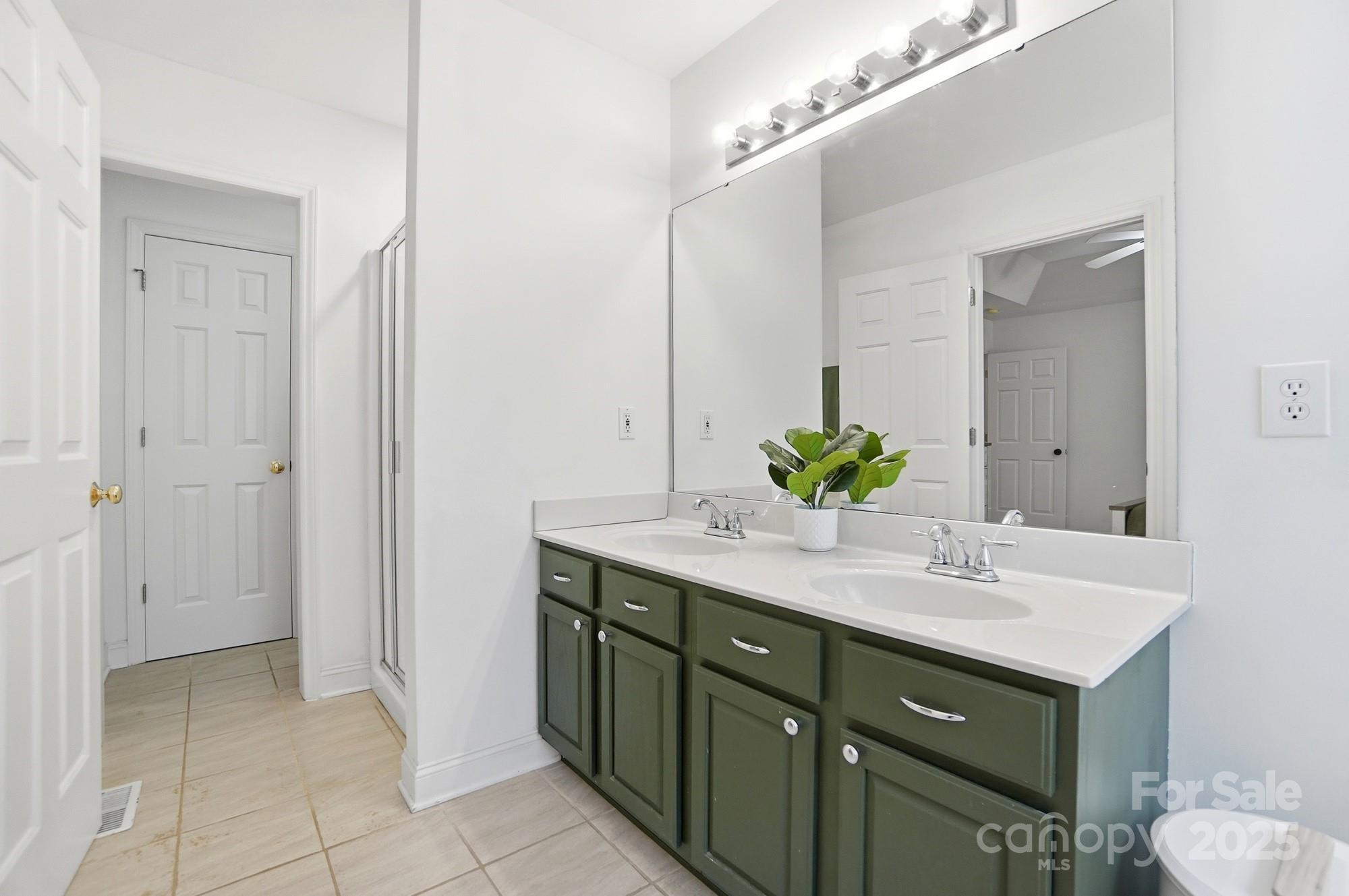 516 Jim Parker Road Monroe, NC 28110 - Photo 20 of 37 a bathroom with a sink and a mirror