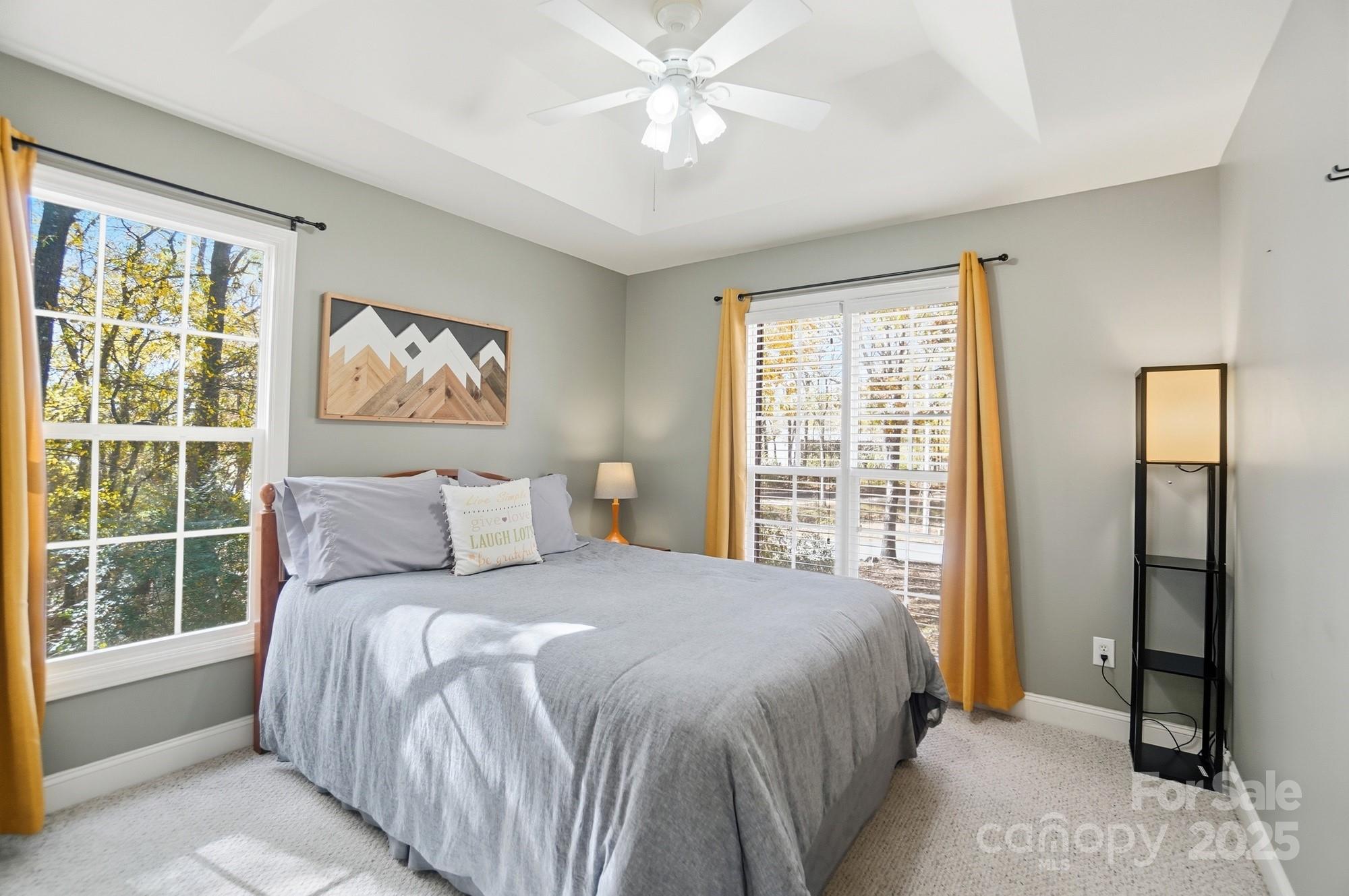 516 Jim Parker Road Monroe, NC 28110 - Photo 22 of 37 a bedroom with a large bed and a window