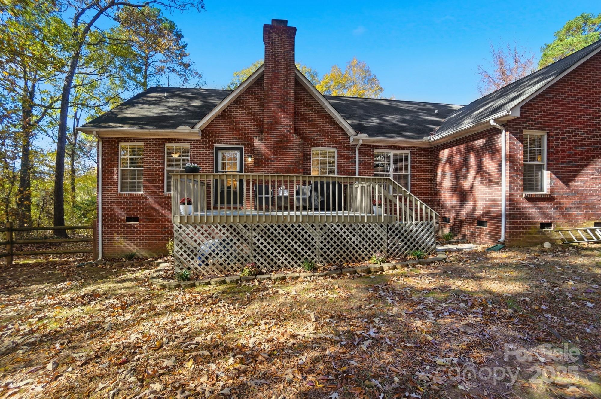 516 Jim Parker Road Monroe, NC 28110 - Photo 33 of 37 a view of a house with a small yard and wooden fence