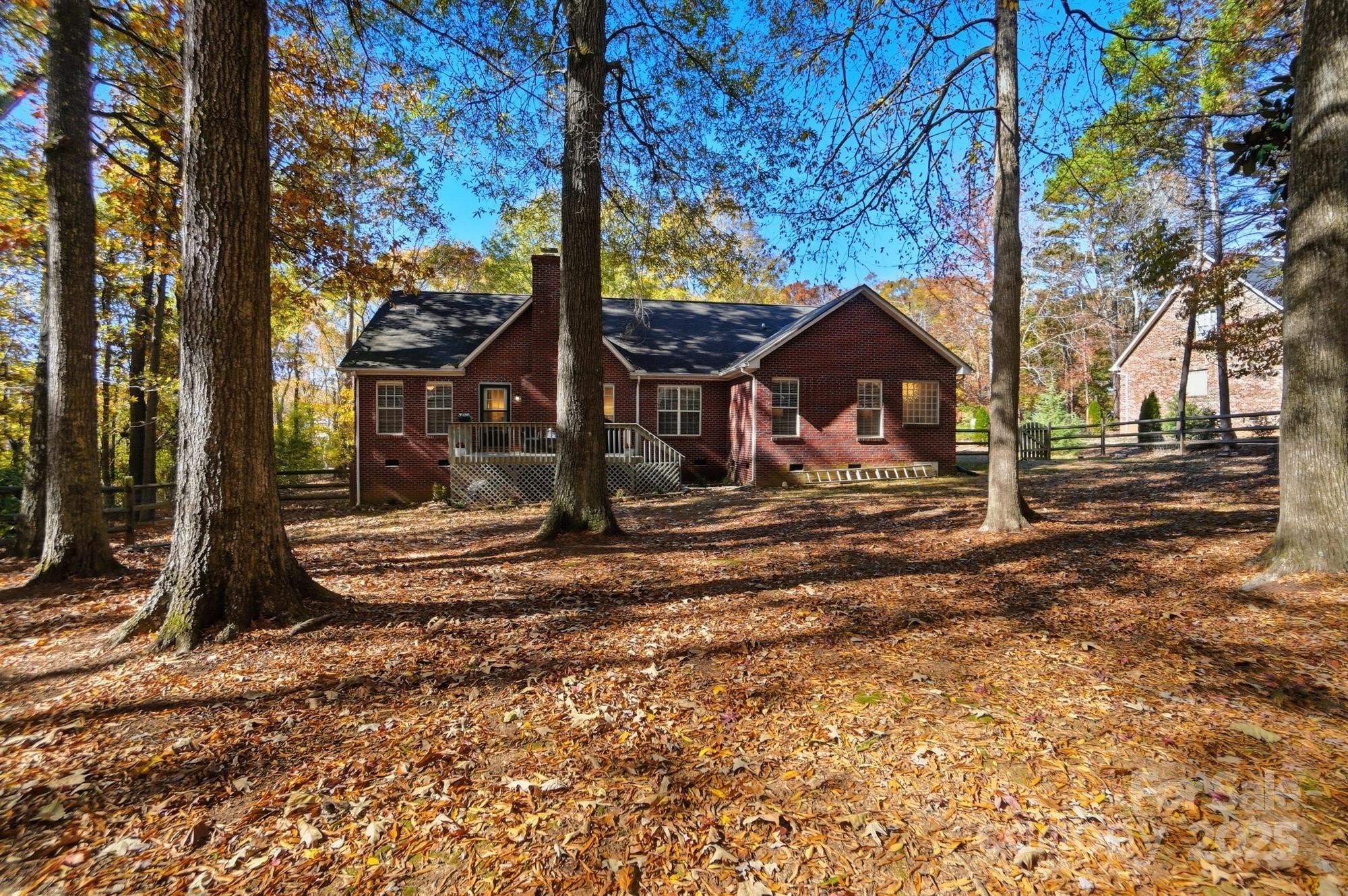 516 Jim Parker Road Monroe, NC 28110 - Photo 35 of 37 a view of a house with a yard covered with snow in the background