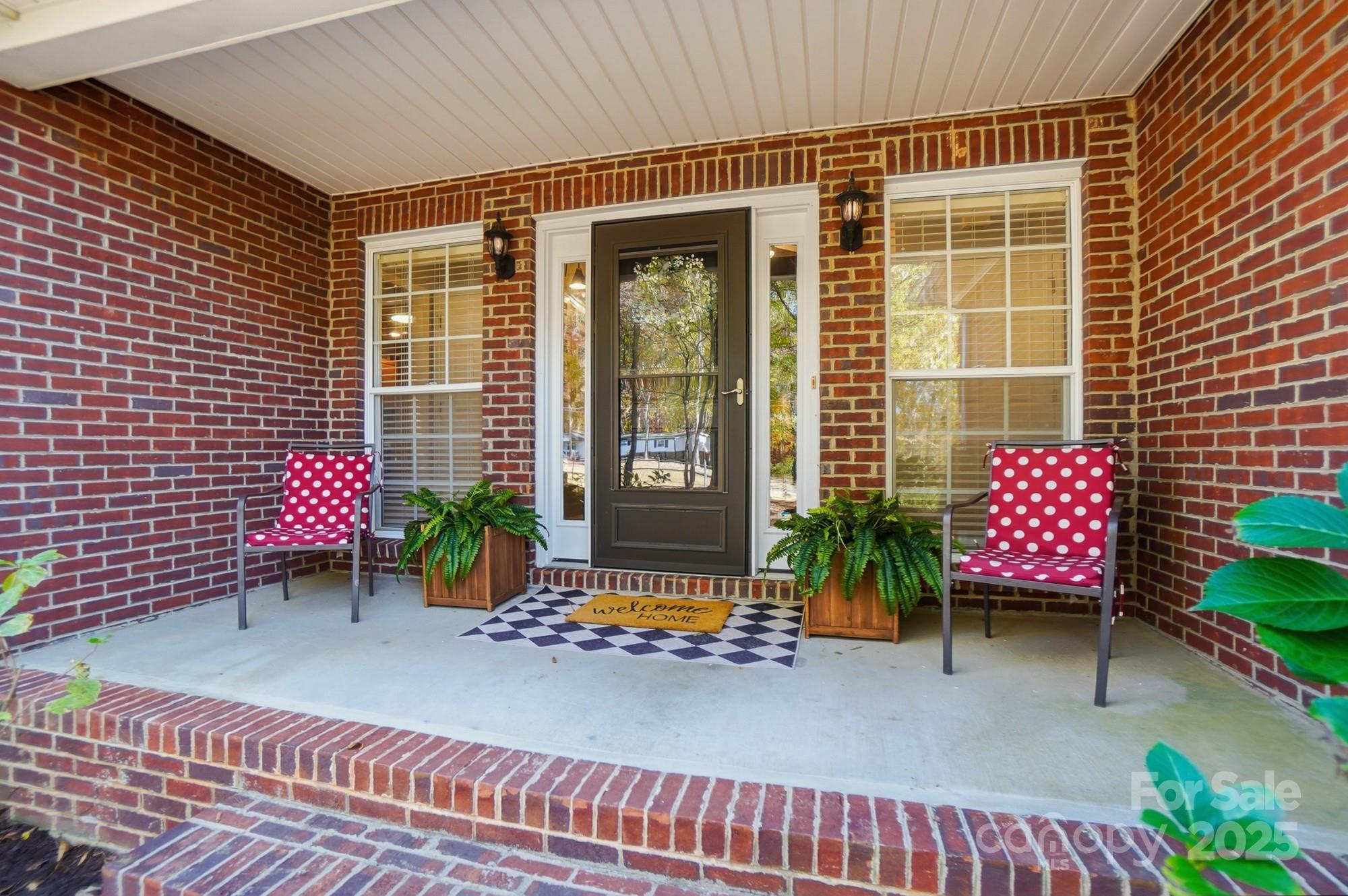 516 Jim Parker Road Monroe, NC 28110 - Photo 4 of 37 a balcony with table and chairs