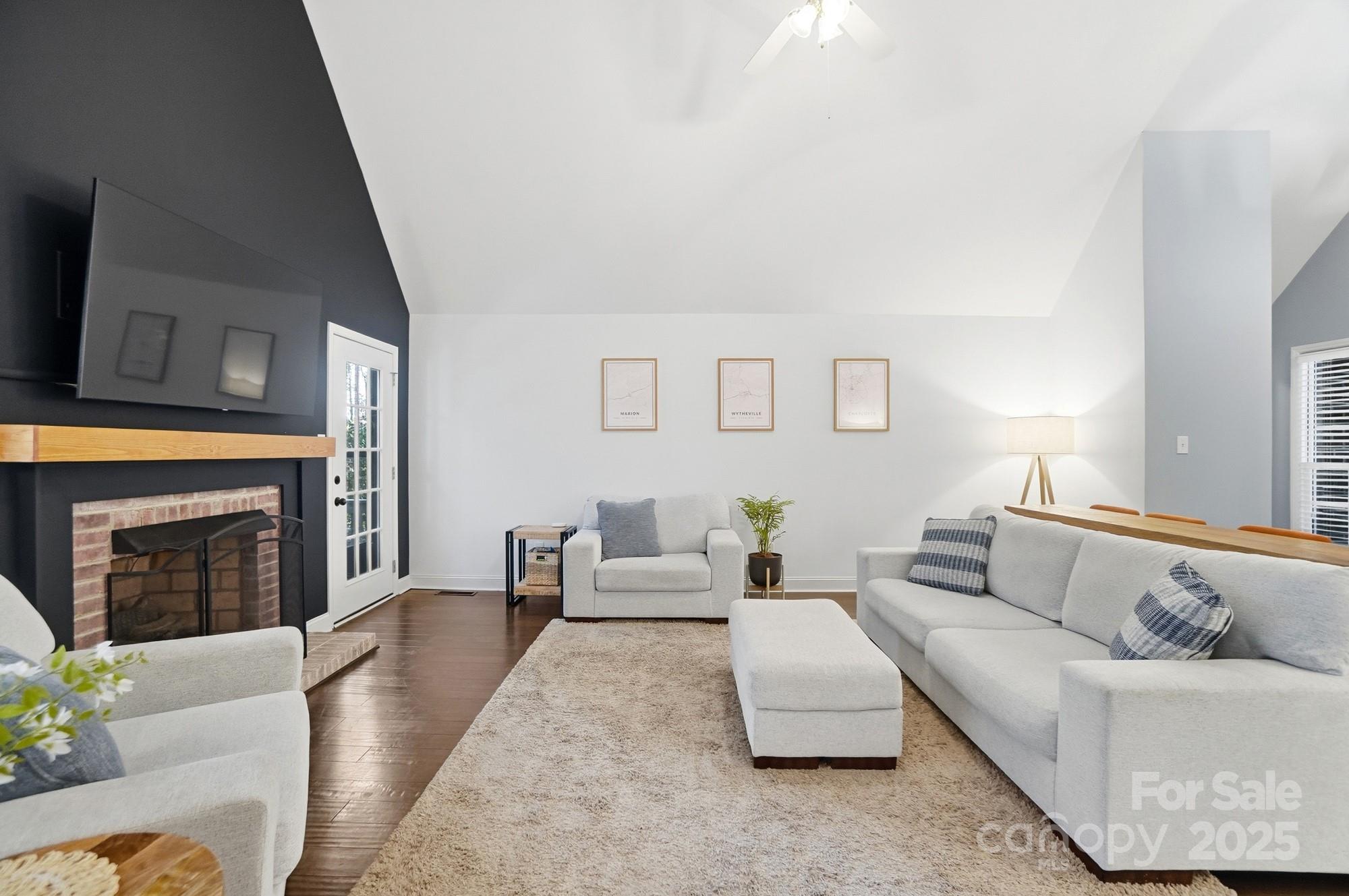 516 Jim Parker Road Monroe, NC 28110 - Photo 8 of 37 a living room with furniture and a fireplace