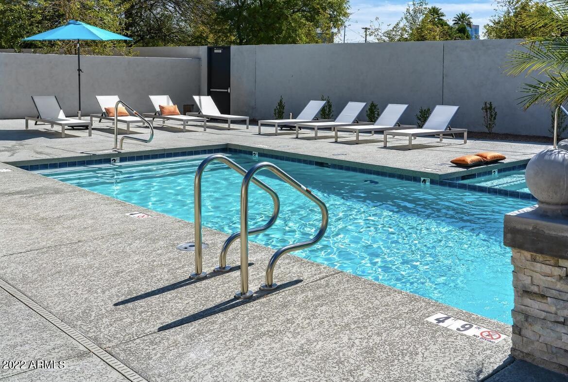 425 West Osborn Road, Unit 302 Phoenix, AZ 85013 - Photo 19 of 31 a view of swimming pool with outdoor seating