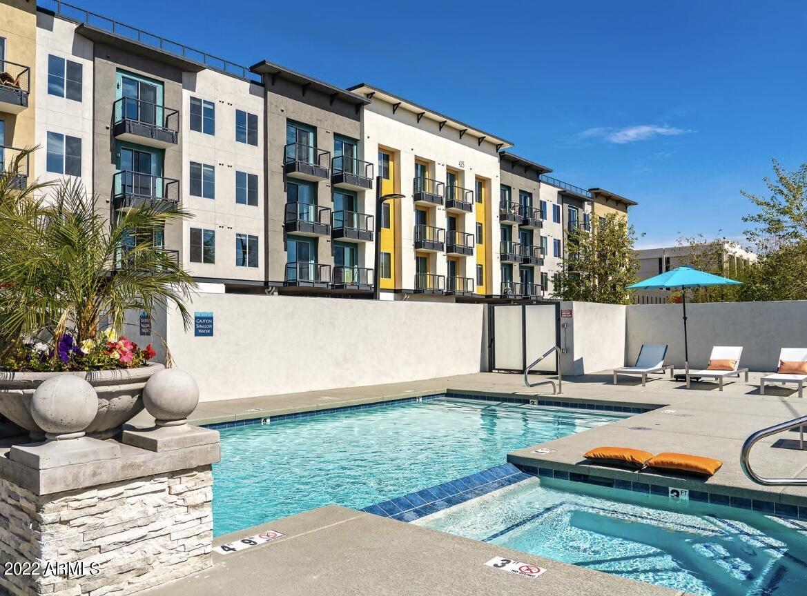 425 West Osborn Road, Unit 302 Phoenix, AZ 85013 - Photo 20 of 31 a front view of a house with swimming pool and sitting area