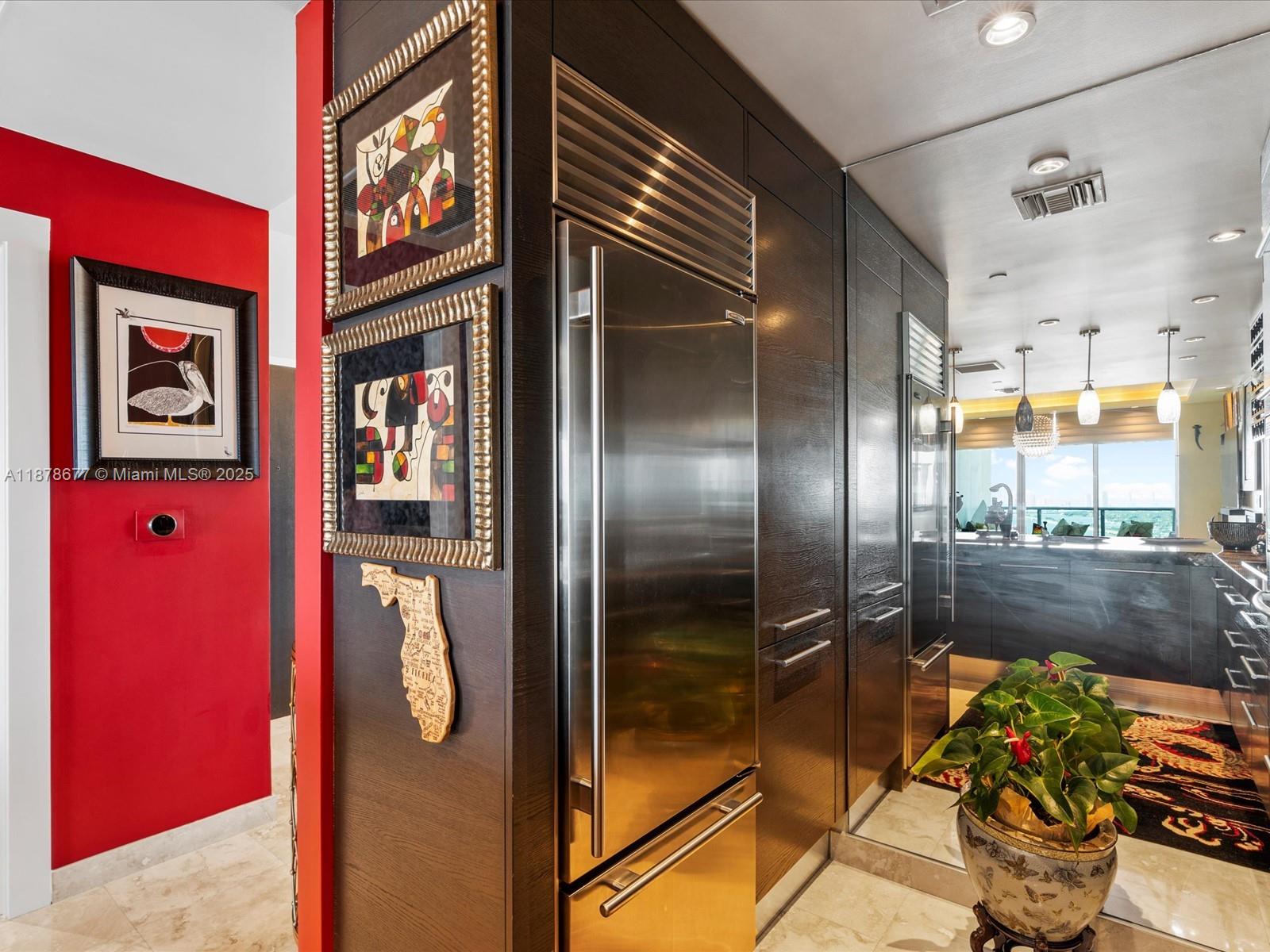 900 Biscayne Boulevard, Unit 3709 Miami, FL 33132 - Photo 15 of 57 a kitchen with stainless steel appliances granite countertop a refrigerator and a stove