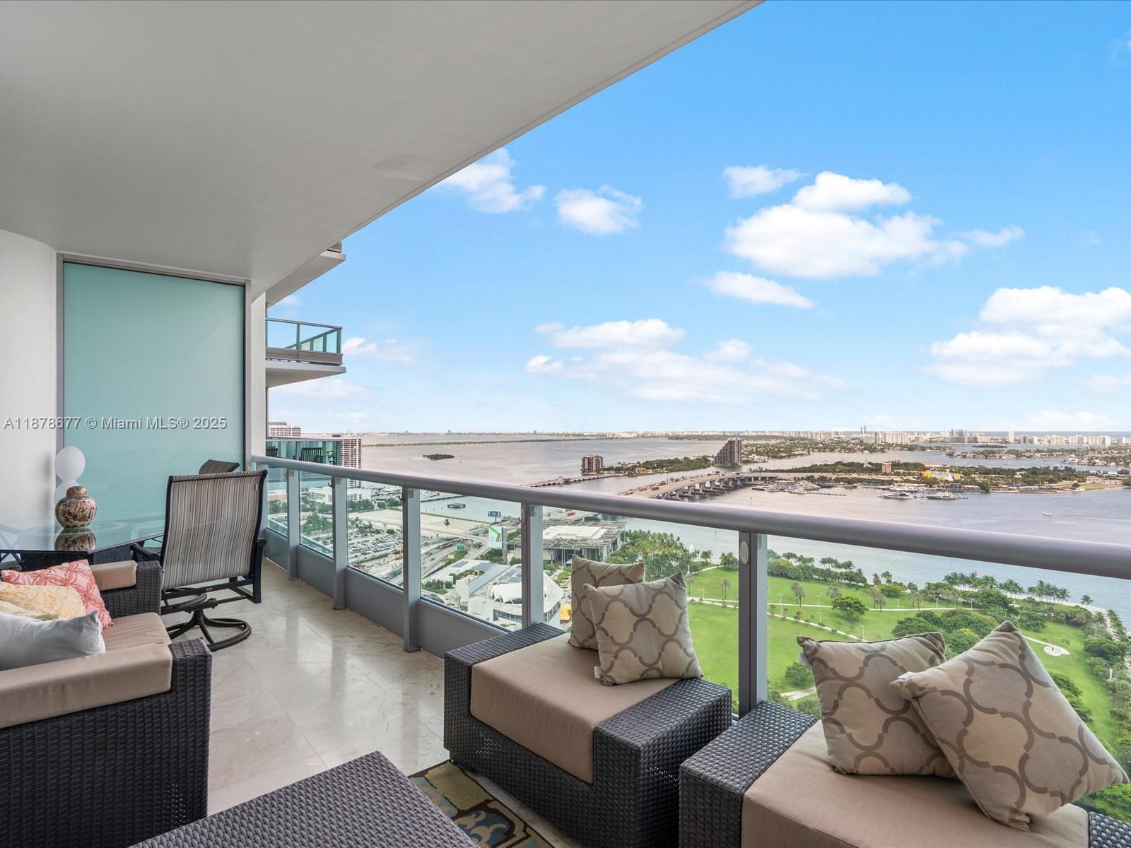 900 Biscayne Boulevard, Unit 3709 Miami, FL 33132 - Photo 2 of 57 a view of a terrace with couches and a potted plant