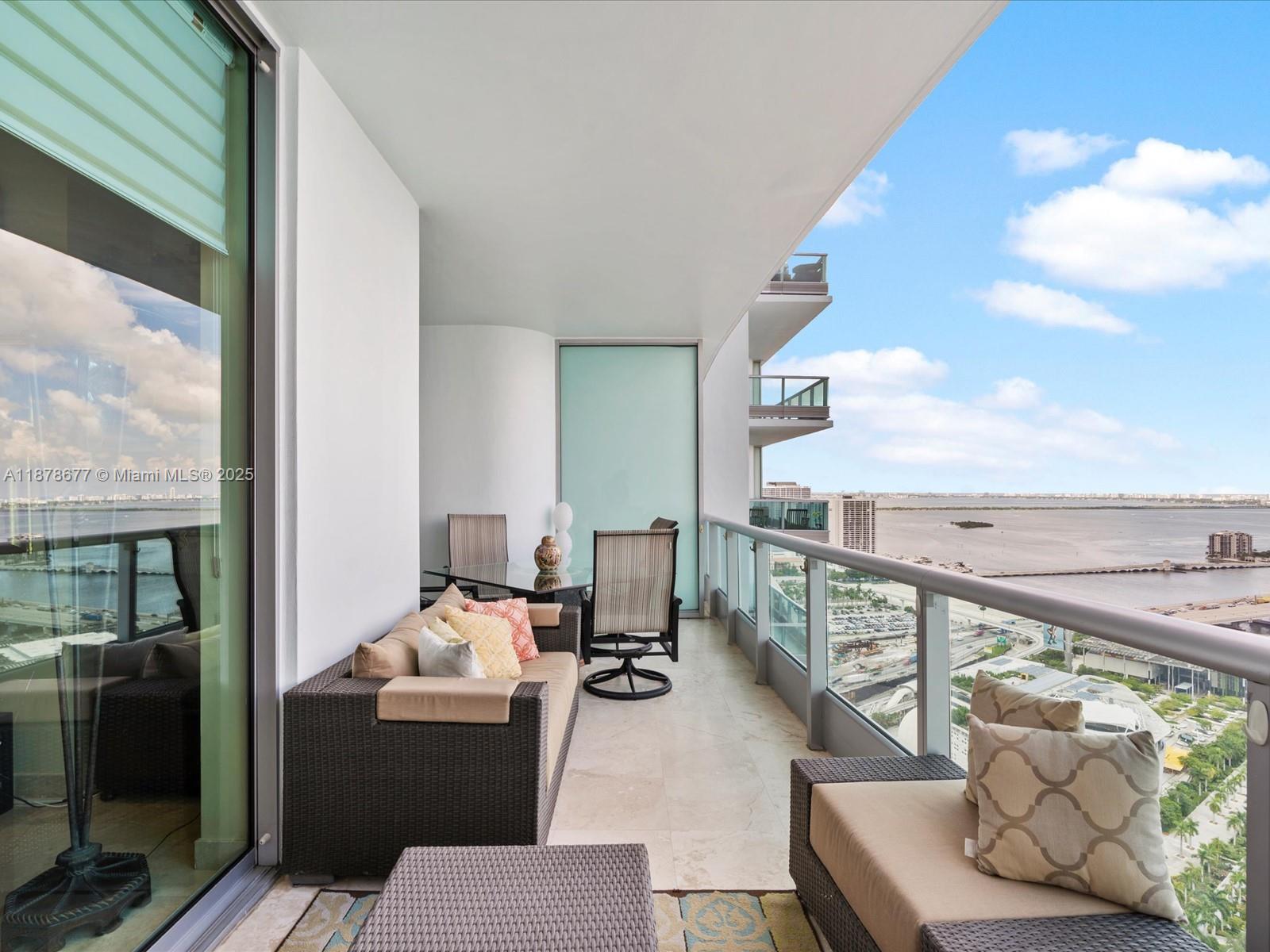 900 Biscayne Boulevard, Unit 3709 Miami, FL 33132 - Photo 24 of 57 a balcony with furniture and a potted plant
