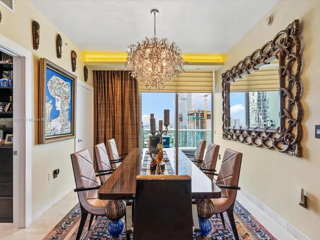 a view of walk in closet with clothes