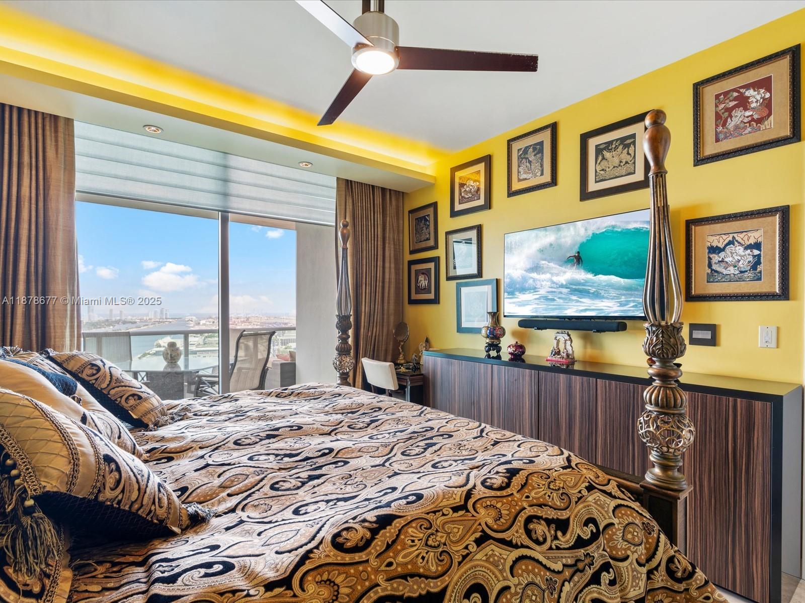 900 Biscayne Boulevard, Unit 3709 Miami, FL 33132 - Photo 28 of 57 a bedroom with a bed and wooden floor