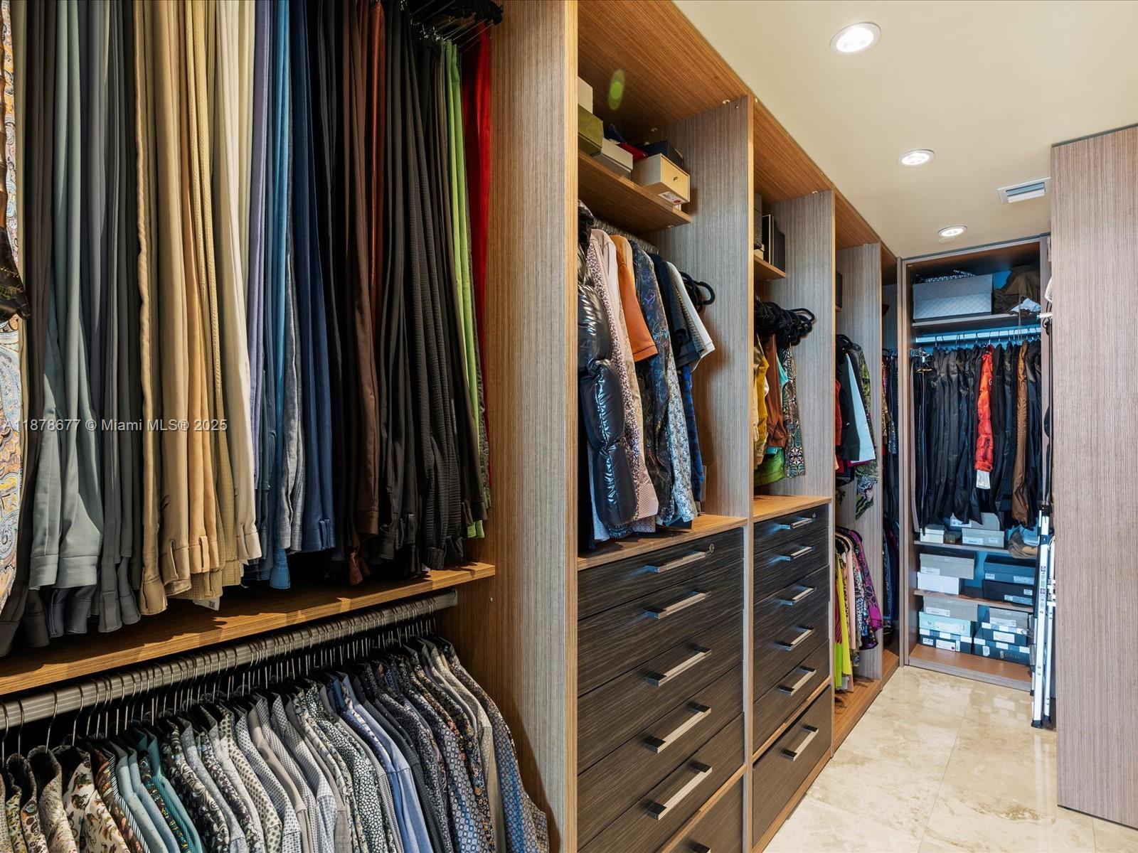 900 Biscayne Boulevard, Unit 3709 Miami, FL 33132 - Photo 29 of 57 a view of walk in closet with clothes