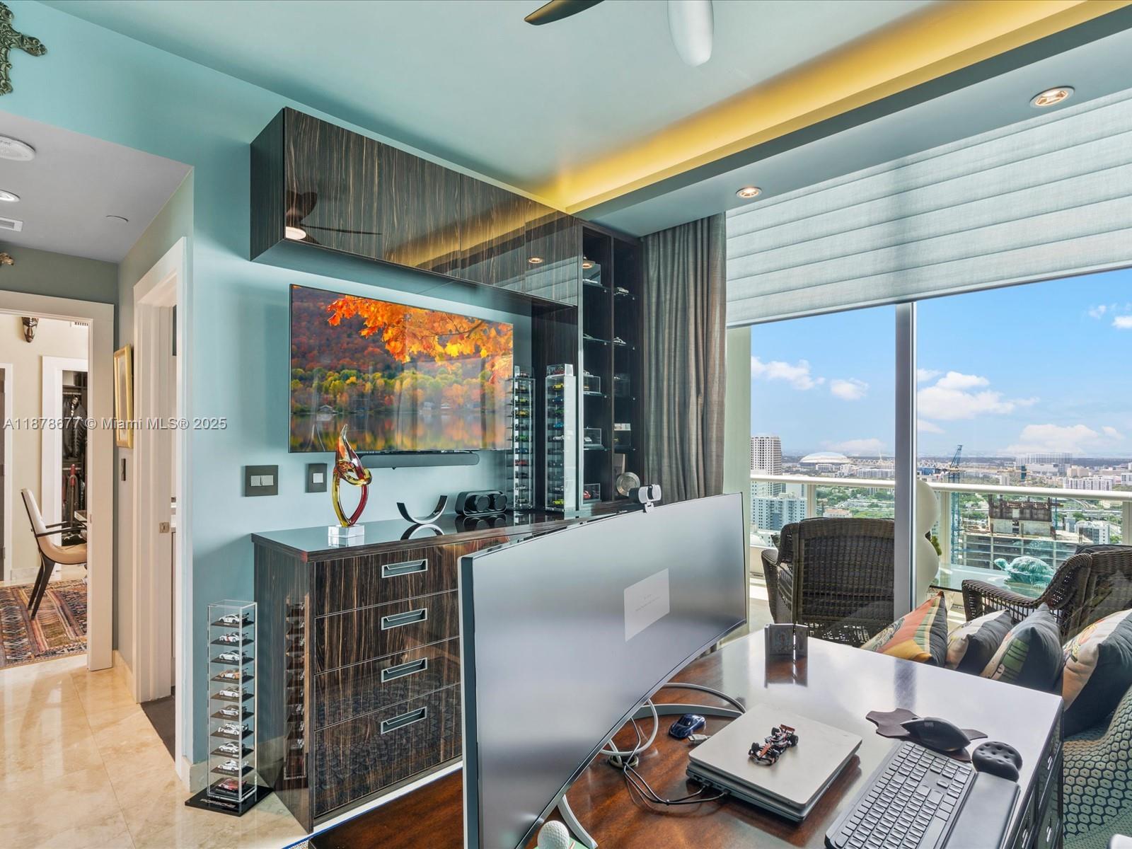 900 Biscayne Boulevard, Unit 3709 Miami, FL 33132 - Photo 35 of 57 a living room with furniture a large window with projector the view