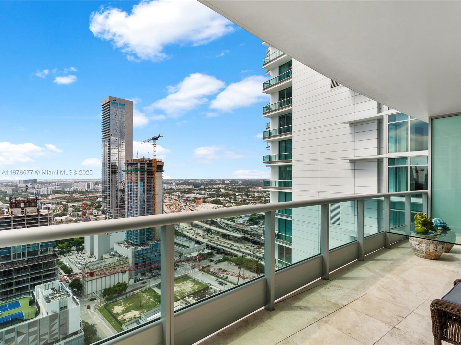 900 Biscayne Boulevard, Unit 3709 Miami, FL 33132 - Photo 44 of 57 a view of a balcony with a potted plant