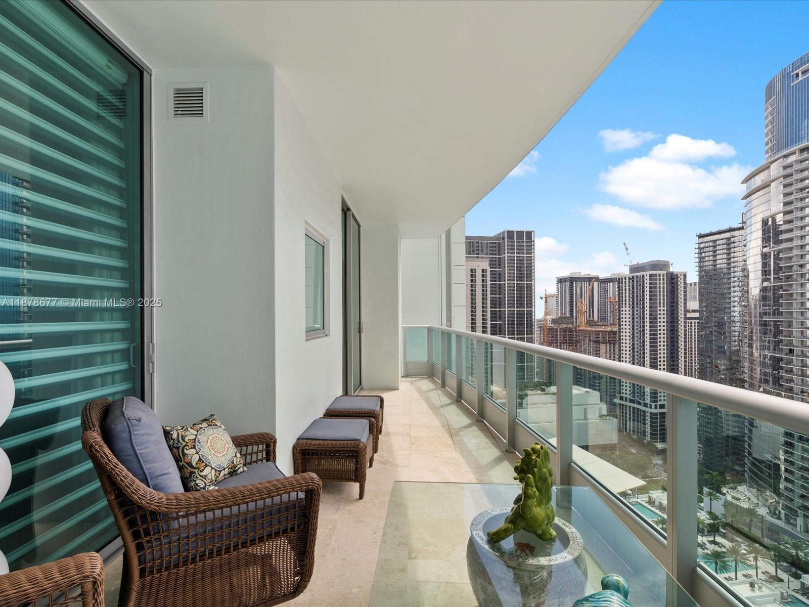 900 Biscayne Boulevard, Unit 3709 Miami, FL 33132 - Photo 45 of 57 a balcony with furniture and a potted plant