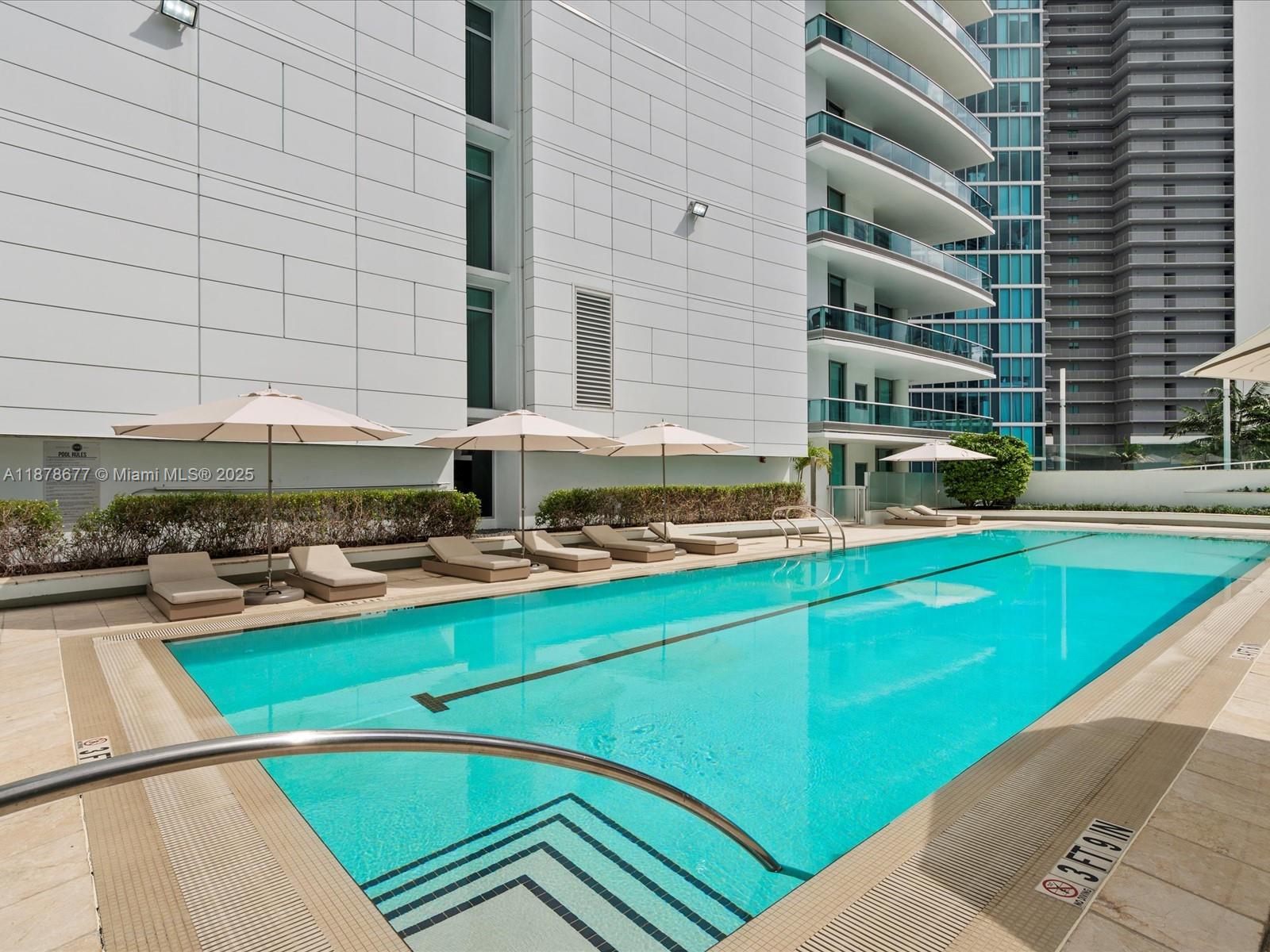 900 Biscayne Boulevard, Unit 3709 Miami, FL 33132 - Photo 48 of 57 a view of a swimming pool with chairs