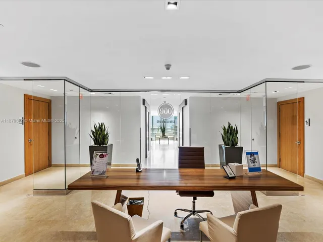 a lobby with furniture and floor to ceiling window