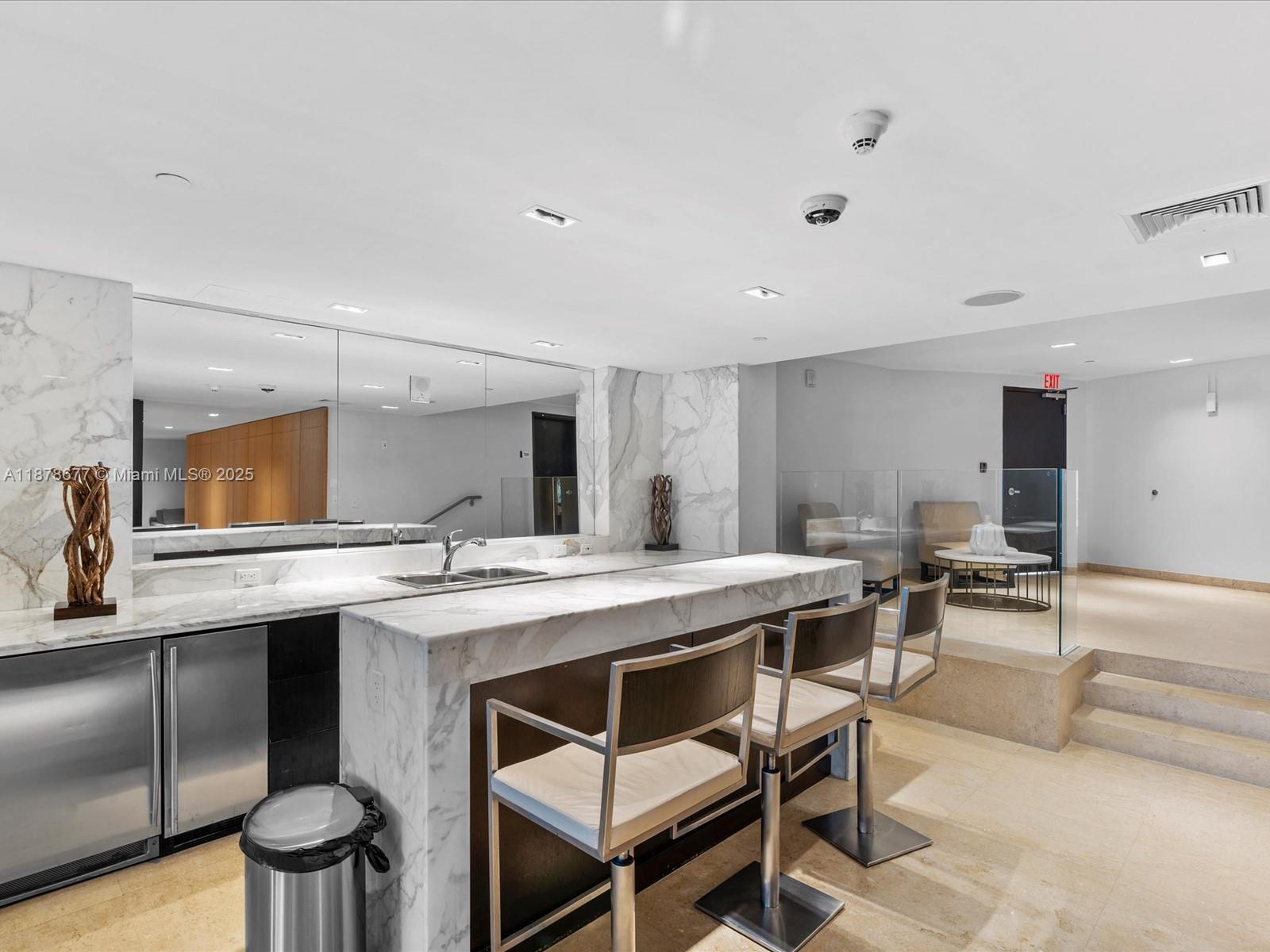900 Biscayne Boulevard, Unit 3709 Miami, FL 33132 - Photo 53 of 57 a kitchen with a stove and cabinets