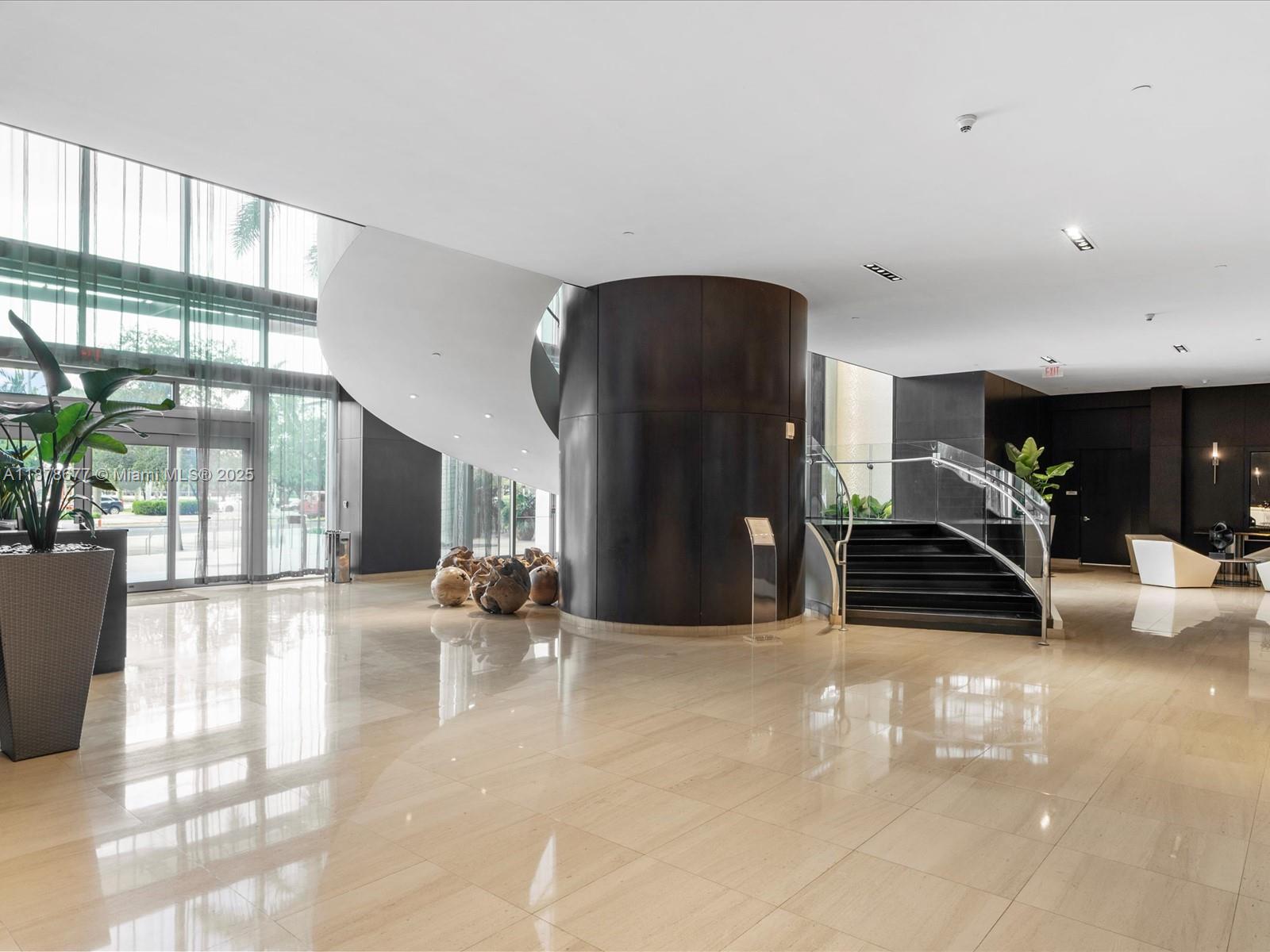 900 Biscayne Boulevard, Unit 3709 Miami, FL 33132 - Photo 55 of 57 a lobby with furniture and floor to ceiling window