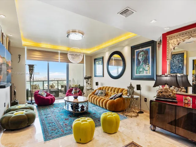 a living room with furniture a rug and a large window