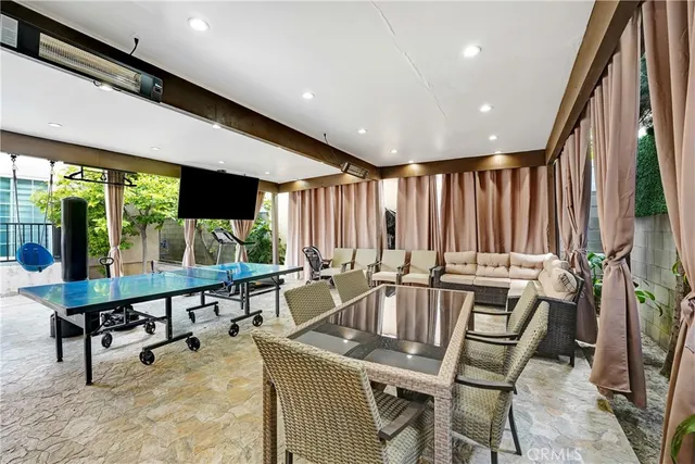 a room with lots of furniture and a large window