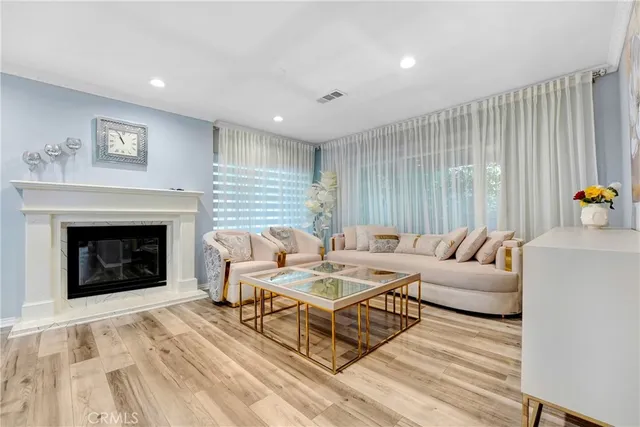 a living room with furniture and a fireplace