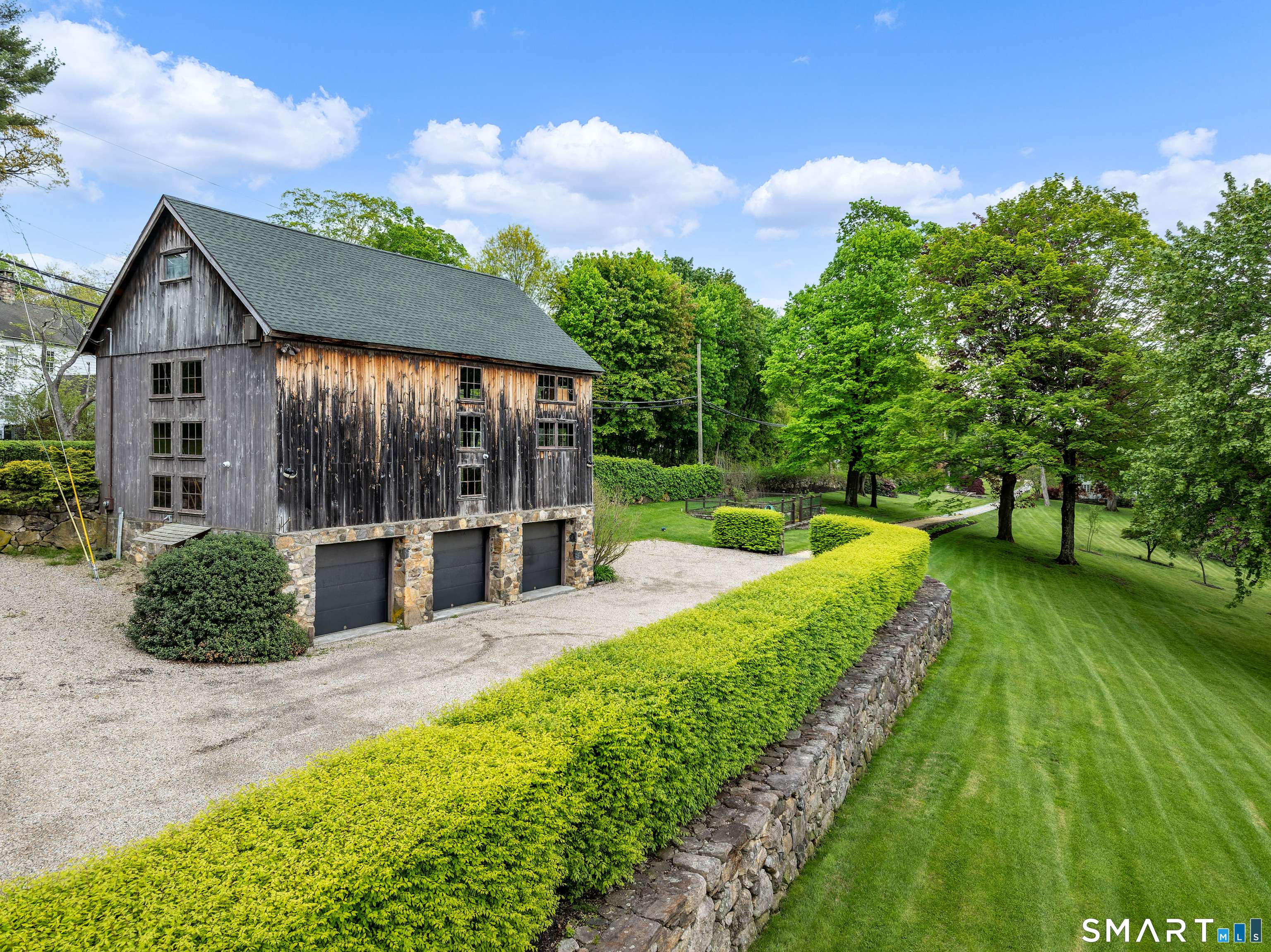 155 Long Ridge Road Danbury, CT 06810 - Photo 14 of 40 The vintage barn is one of the most distinctive outbuildings on the estate, adding both beauty and long-term flexibility to the property.