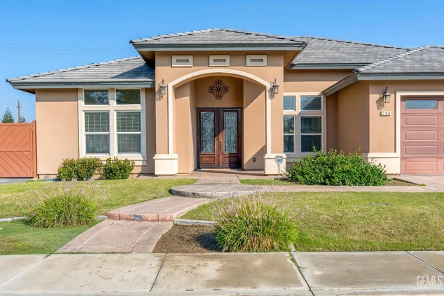 a front view of a house with garden