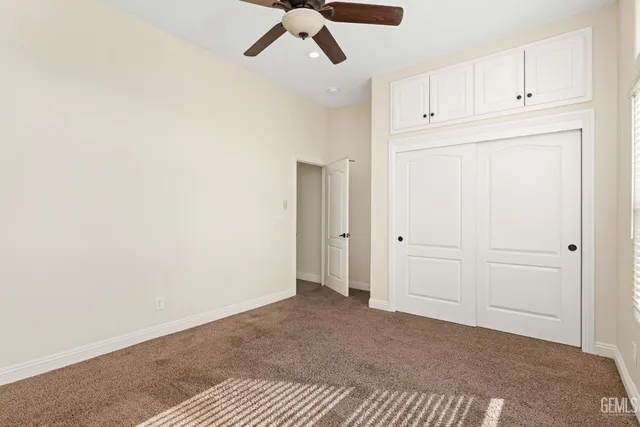 a view of a microwave and cabinets