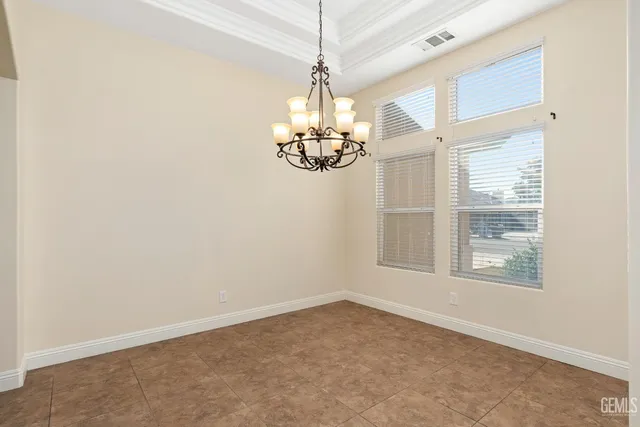 an empty room with windows and entrance