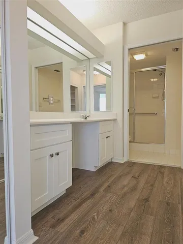 a view of a sink and a mirror