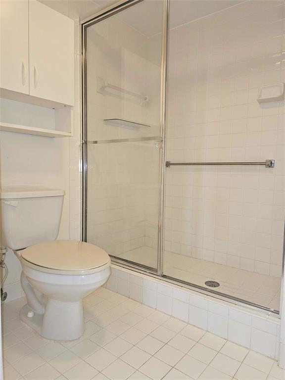7843 Granville Drive, Unit 7843 Tamarac, FL 33321 - Photo 13 of 26 a bathroom with a toilet and a shower