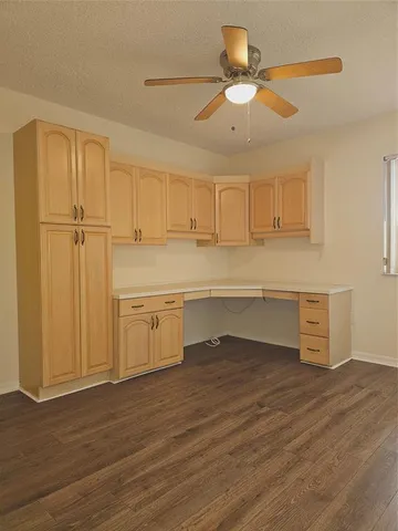 a view of a kitchen with wooden floor