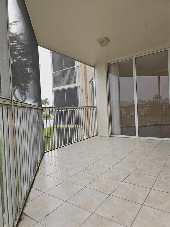 7843 Granville Drive, Unit 7843 Tamarac, FL 33321 - Photo 19 of 26 a view of an empty room with a balcony