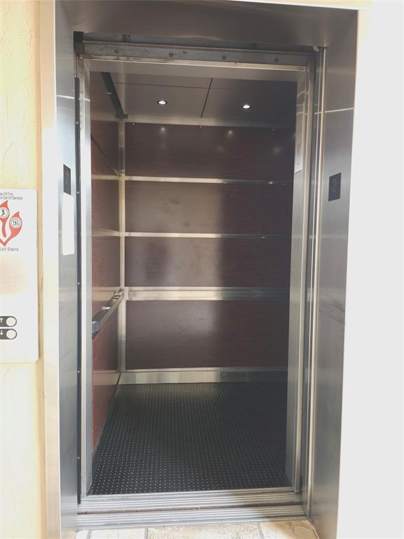 7843 Granville Drive, Unit 7843 Tamarac, FL 33321 - Photo 24 of 26 a view of walk in closet with empty racks