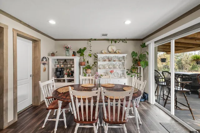 a view of a dining room with furniture window and outside view