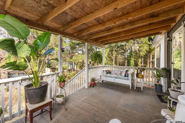 a balcony with furniture and rug