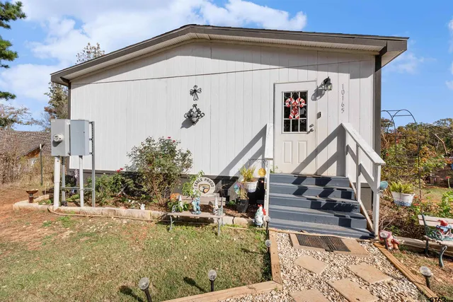 a view of a house with a small yard