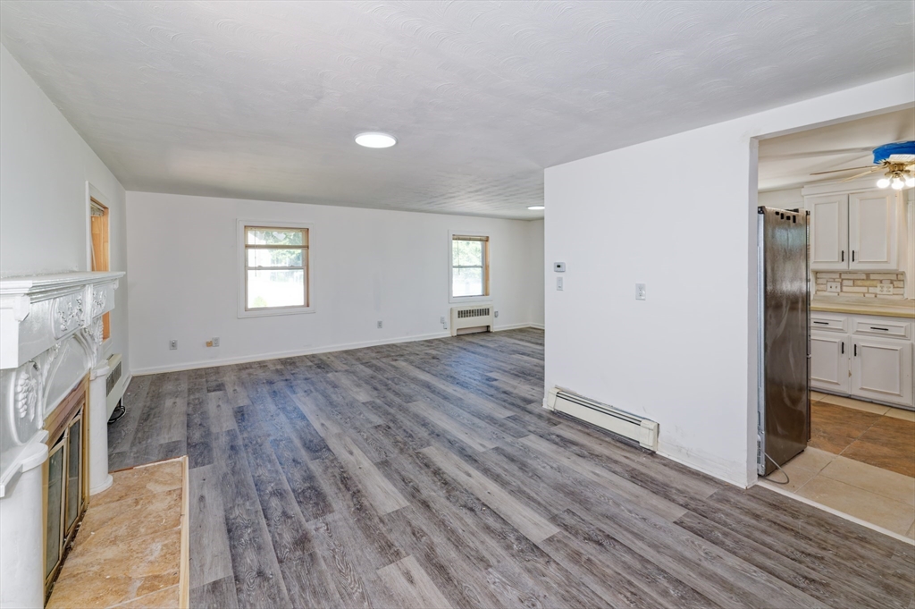 1 Rockland Rd Court Auburn, MA 01501 - Photo 9 of 38 a view of empty room with wooden floor and fan