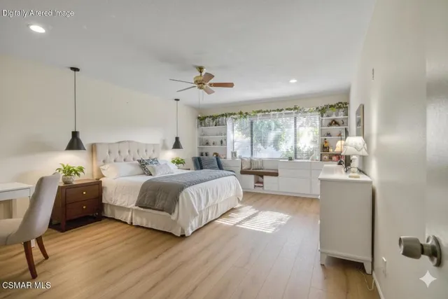 a bedroom with a bed and a chair