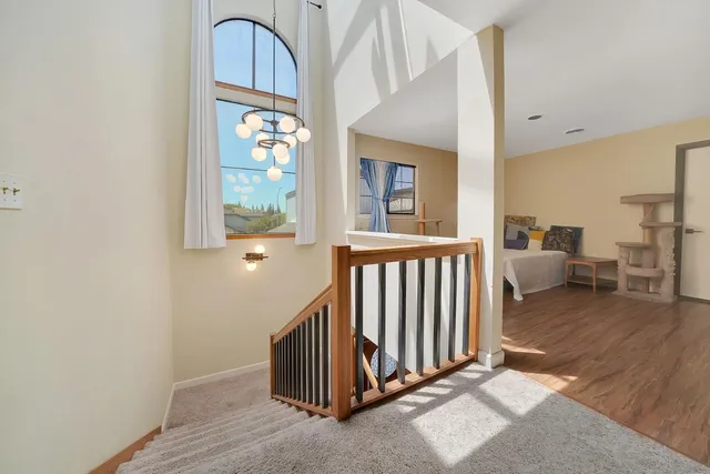 a kitchen with stainless steel appliances granite countertop a sink refrigerator and cabinets