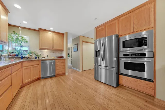 a dining room with furniture a livingroom and chandelier