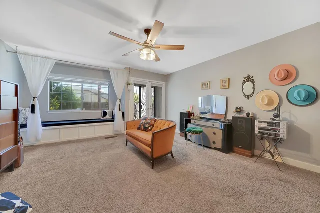 a view of a livingroom with workspace and a couch
