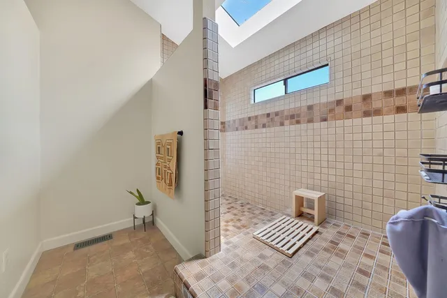a bathroom with a toilet a sink and a mirror