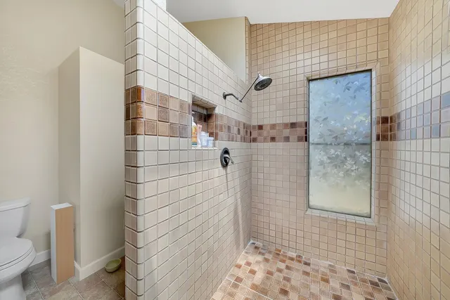 a house view with a sitting space and wooden floor