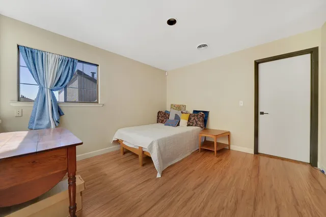 a front view of a house with a yard and a garage