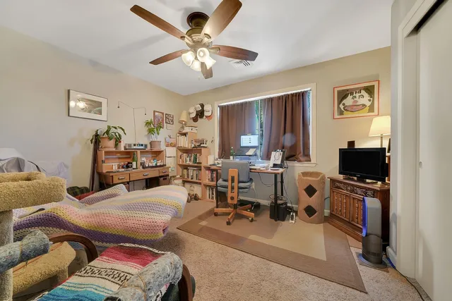 a backyard of a house with yard and outdoor seating