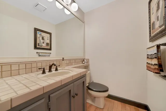 an aerial view of a house with a yard garage and a patio