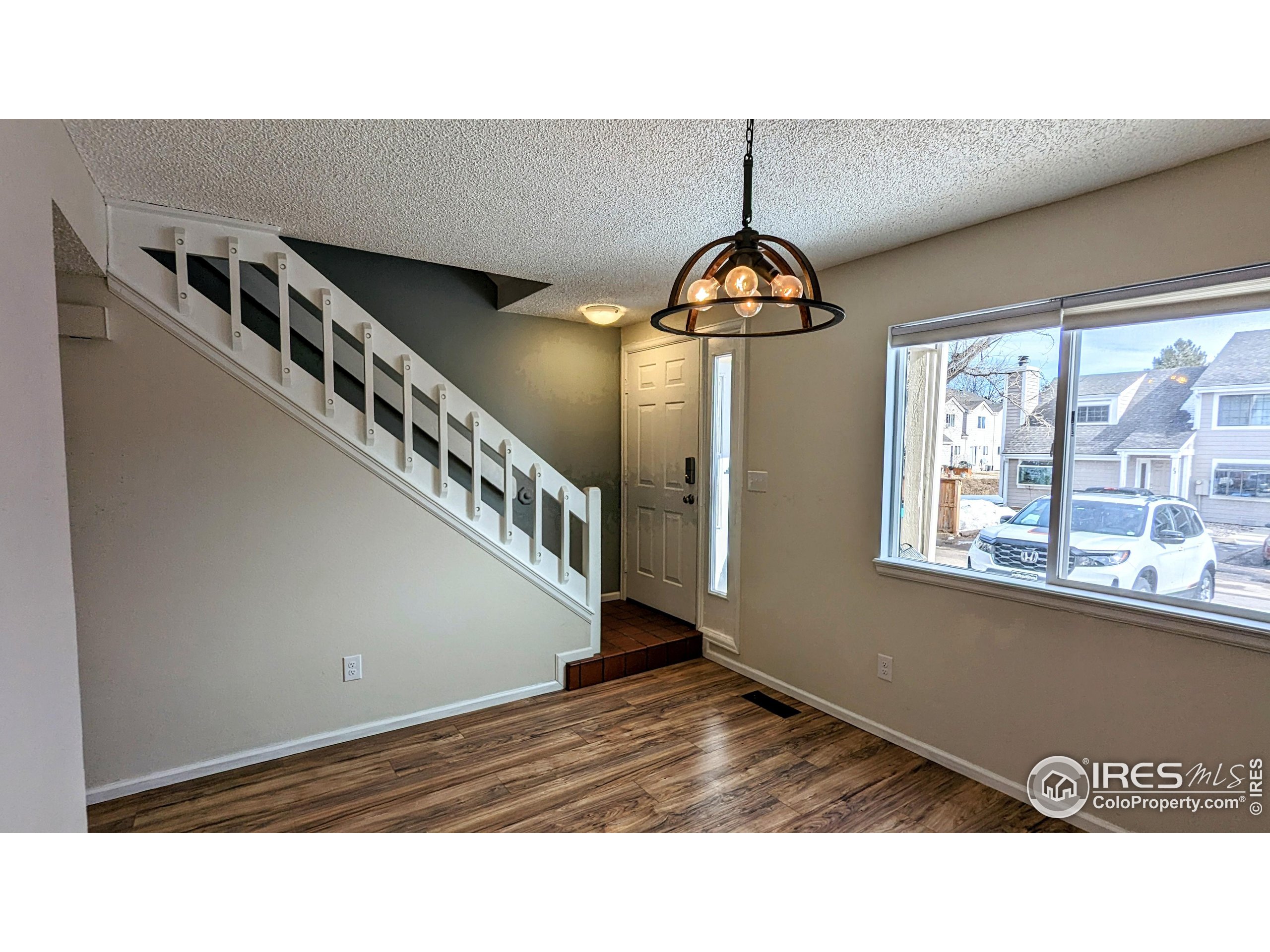 2924 Ross Drive, Unit 19 Fort Collins, CO 80526 - Photo 1 of 28 a view of entryway and hall with wooden floor