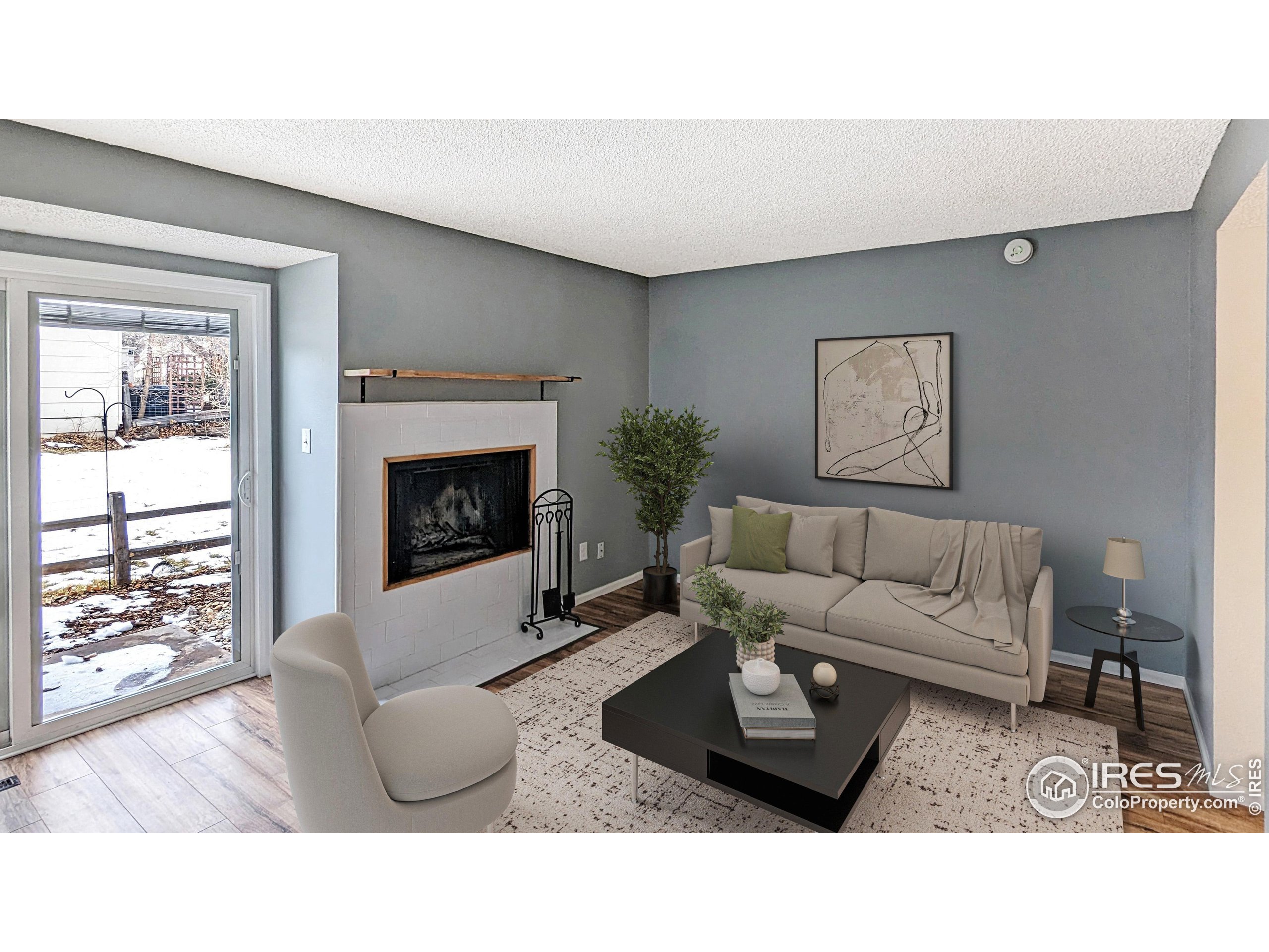 2924 Ross Drive, Unit 19 Fort Collins, CO 80526 - Photo 11 of 28 a living room with furniture a window and a fireplace