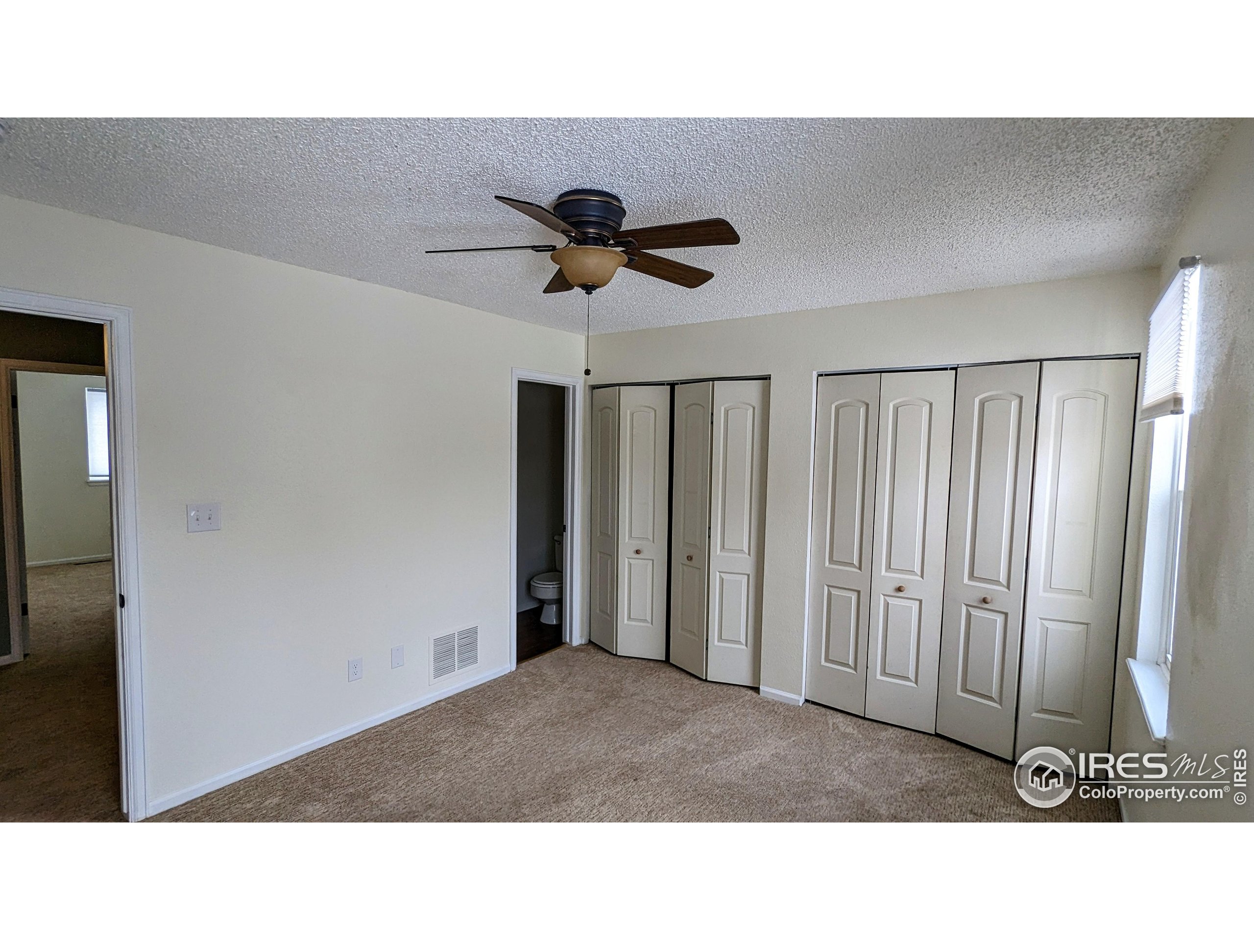 2924 Ross Drive, Unit 19 Fort Collins, CO 80526 - Photo 20 of 28 a black and white kitchen with a sink